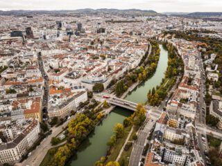 Aerial view of Vienna showcasing the city's iconic landmarks, historic architecture, and green spaces. If you're wondering where to go in Vienna, this panoramic perspective highlights its many attractions.